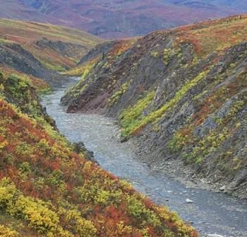 Item 2 This V-shaped valley was formed as sediment was moved from one place and deposited-example-1