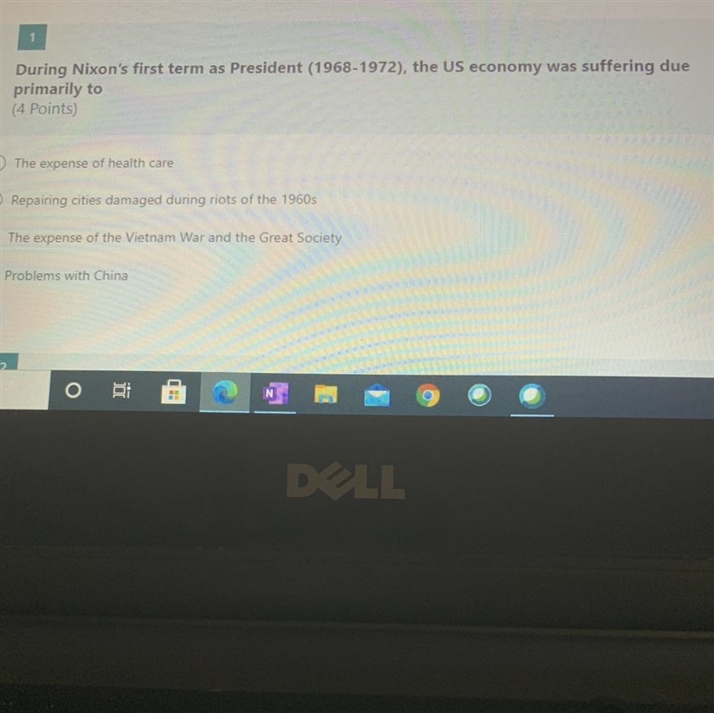 During Nixon's first term as President the US economy was suffering due primarily-example-1