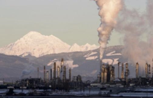 The image shows an oil refinery in Washington. Which best explains how this refinery-example-1