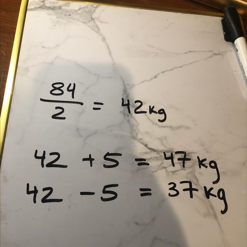 two boys together weigh 84 kg. if one boy is 10 kg heavier than the other, calculate-example-1