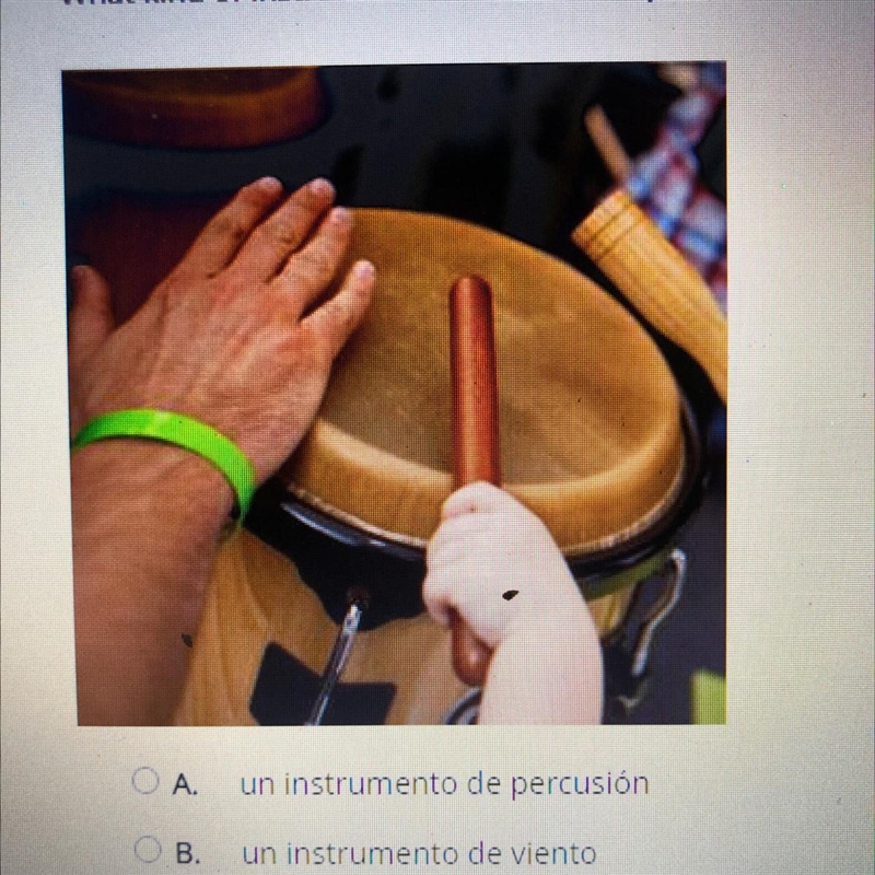 What kind of instrument is shown in the picture? ОА un instrumento de percusión О-example-1