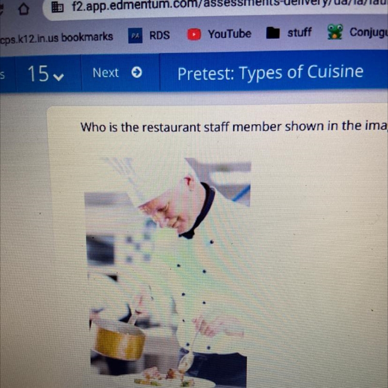 Who is the restaurant staff member shown in the image? O A. el camarero B. el chef-example-1