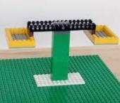 using Lego's, built a structure that is balanced and symmetrical. Photograph it. pls-example-1