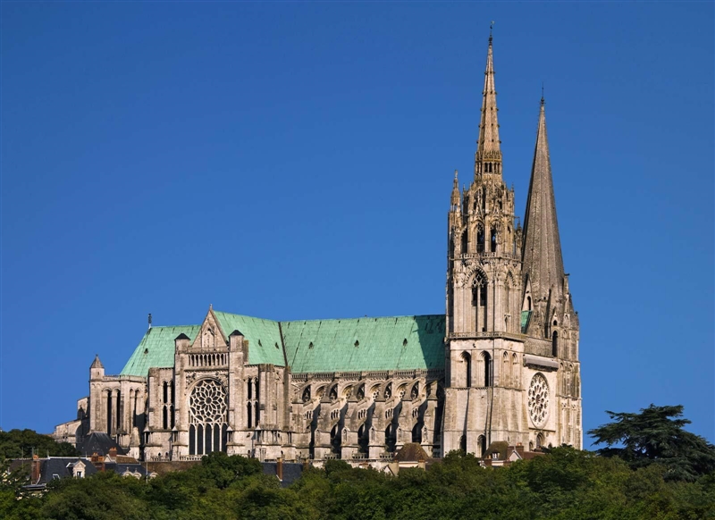 Refer to the image below and discuss which aspects of Chartres are Romanesque and-example-1