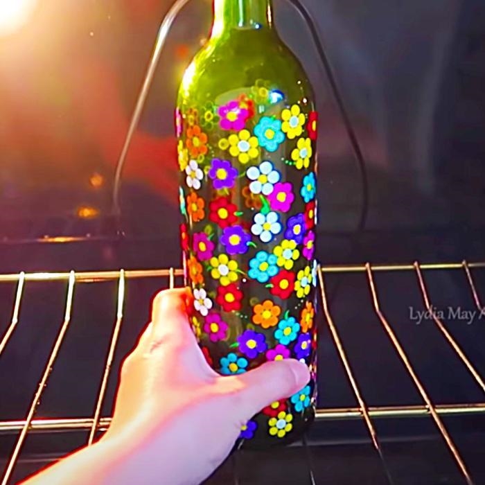 Can you send me some beautiful and easy bottle art with fabric colour​-example-1