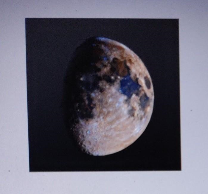 HELP ME OUT PLEASE!!!!!!!!!!!!!!! 16. Identify the moon phase shown at right. (Two-example-1