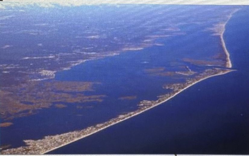 The picture above shows barrier island. How did these barrier island MOST LIKELY form-example-1