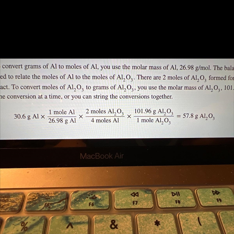 Show the conversions required to solve this problem and calculate the grams of Al-example-1