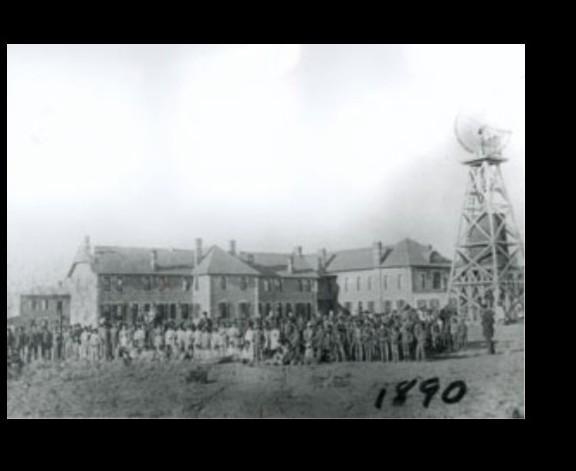 1. What was the Santa Fe Indian School like in its early years?-example-1