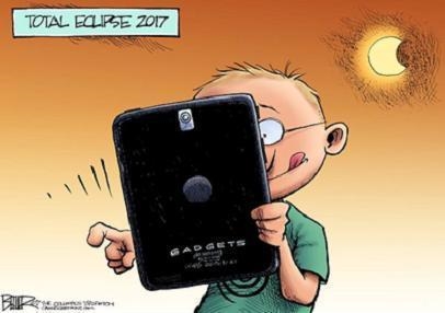 Study the editorial cartoon Total Eclipse 2017 by Nate Beeler. A child's face is half-example-1