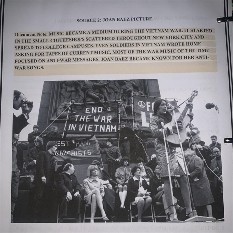 The monument in the back has soldiers on it. Why wound an Anti-War protest take place-example-1