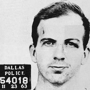 Lee harvey oswald's face when he was told he was charged with murder.-example-1