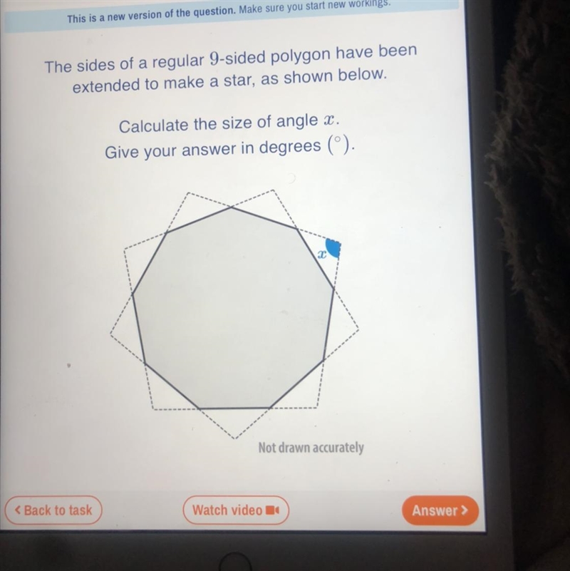 The sides of a regular 9-sided polygon have been extended to make a star, as shown-example-1