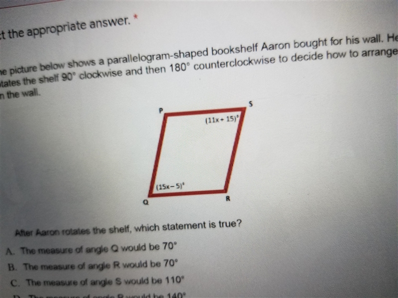 i The picture below shows a parallelogram-shaped bookshelf Aaron bought for his wall-example-1