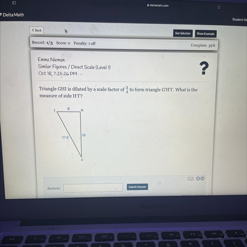 Triangle GHI is dilated by a scale factor of to form triangle G'HT. What is themeasure-example-1