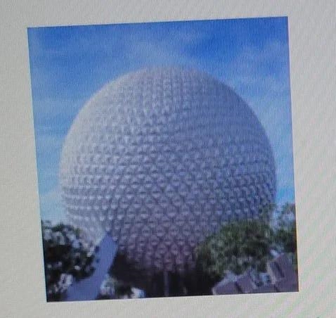 A model of Spaceship Earth, a major tourist attraction at Epcot Center in Florida-example-1