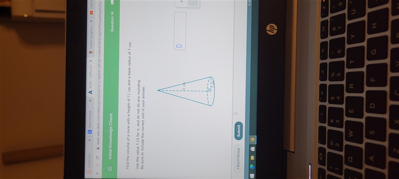 Find the volume of a cone with a height of 11 cm qnd a base radius of 3 cm. Use the-example-1