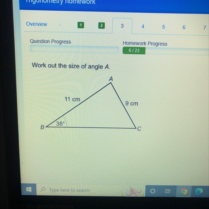 Work out the size of angle A. A B 11 cm 38° 9 cm C-example-1