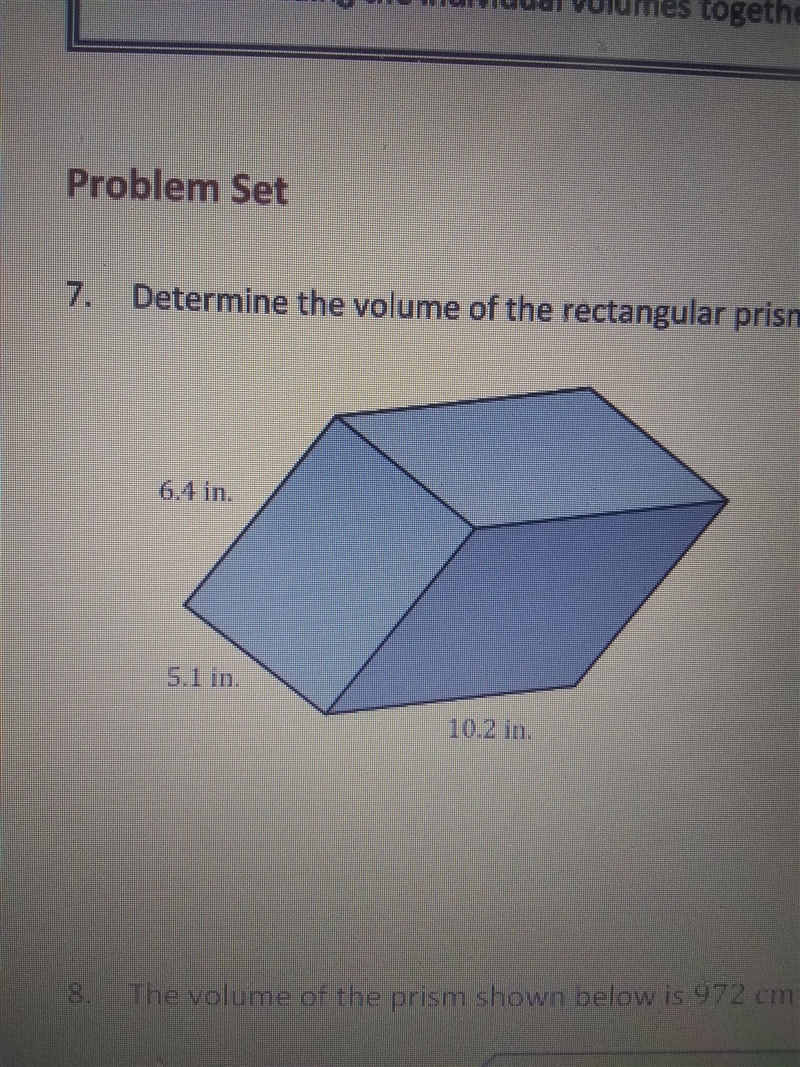 Determine the volume of the rectangular prism show 6.4 in. 5.1 in 10.2 in.-example-1