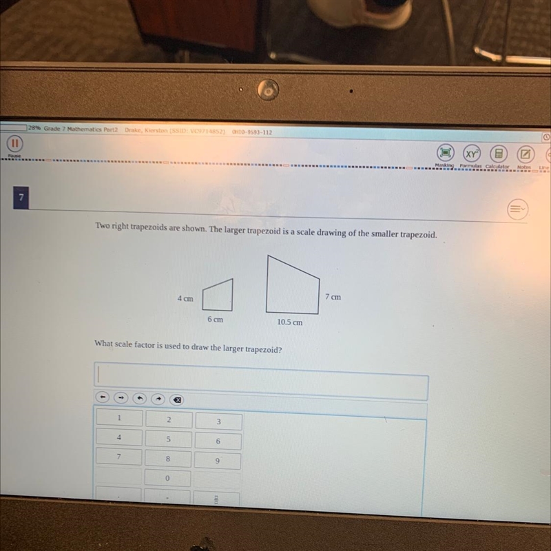 What scale factor is used to draw the longer trapezoid?-example-1