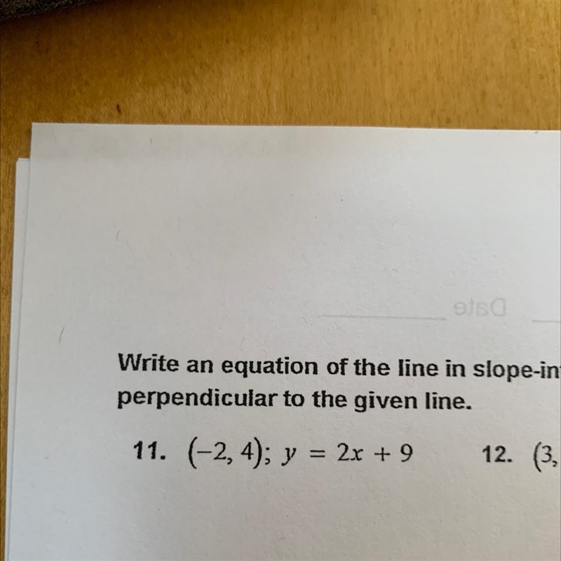 Write an equation of the line in slope intercept form that passes through the given-example-1