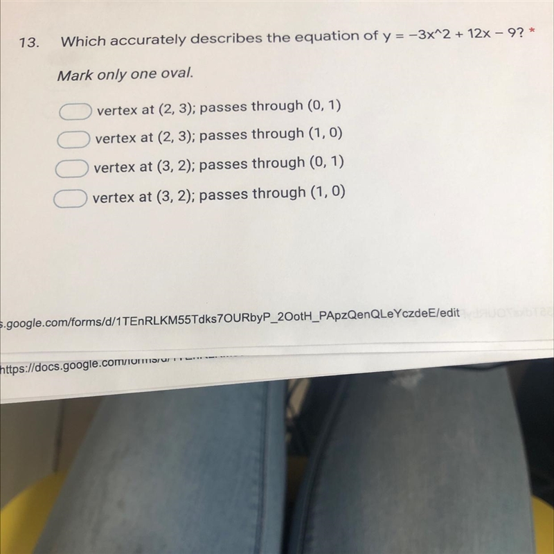 Which accurately describes the equation of y=-3x^2 + 12x - 9? *Mark only one oval-example-1