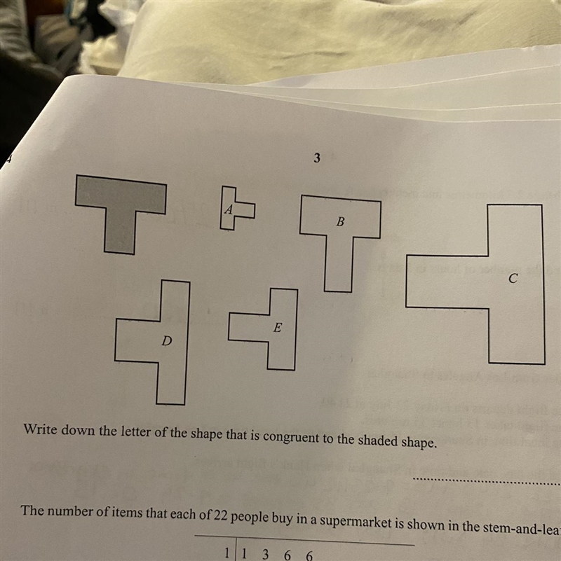 Write down the letter of the shape that is congruent to the shaded shaPe-example-1