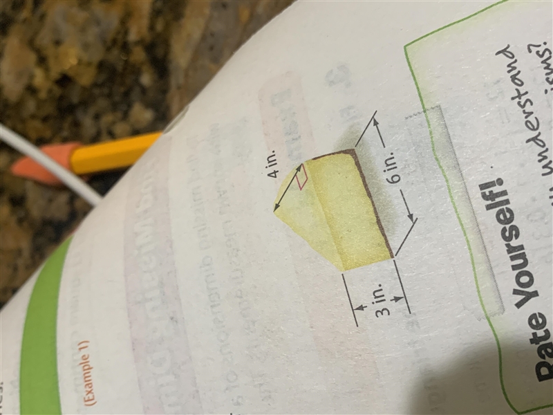 Dirk has a triangular-shaped piece of cheesecake in his lunch. Find the volume of-example-1