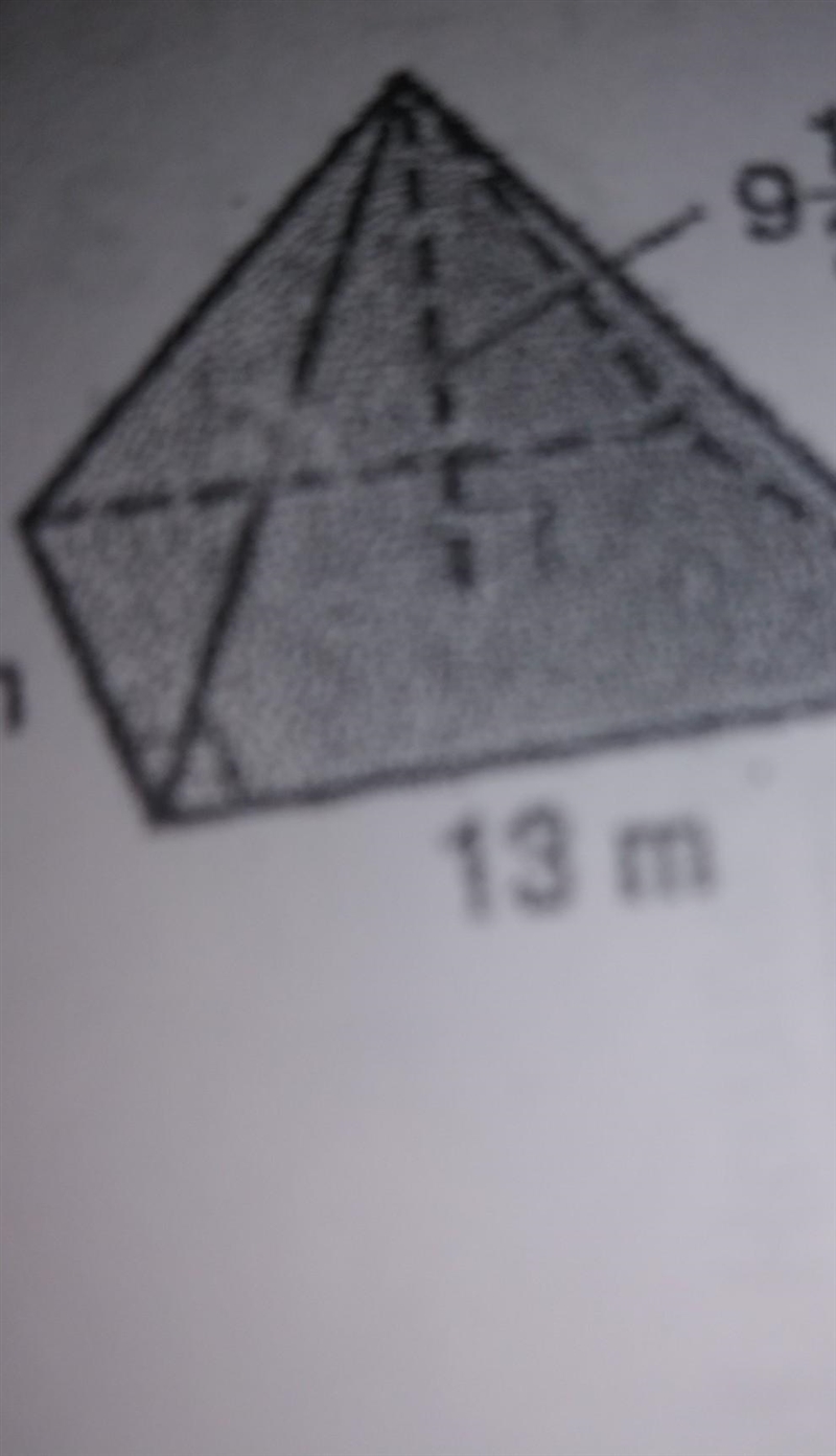 determine the volume of each rectangular or triangular pyramid round to the nearest-example-1