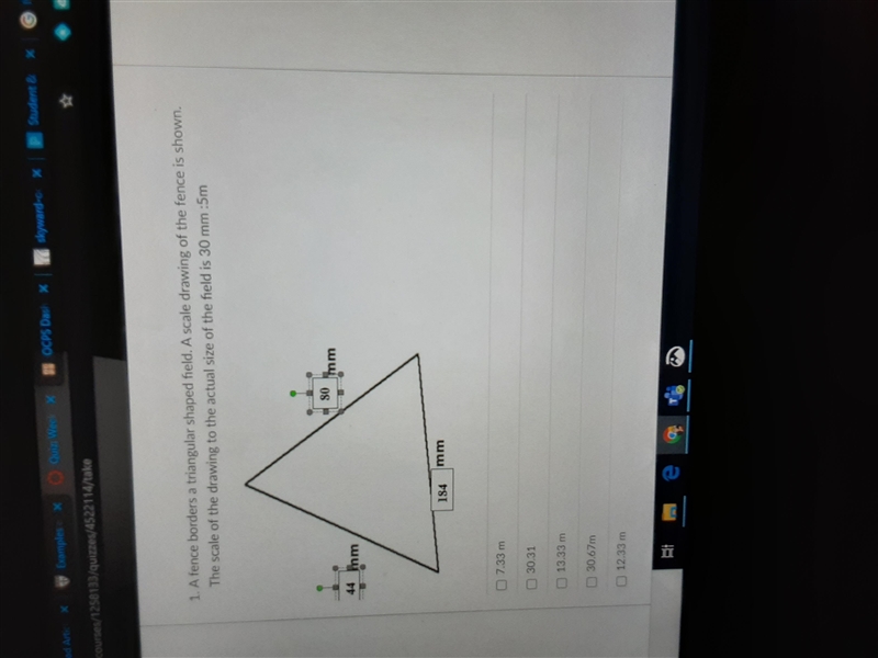 A fence borders a triangular shaped field. A scale drawing of the fence is shown. The-example-1