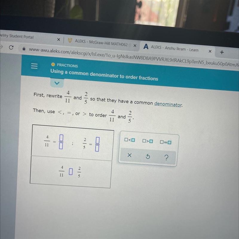 First rewrite 4/11 and 2/5 so that they have a common-example-1