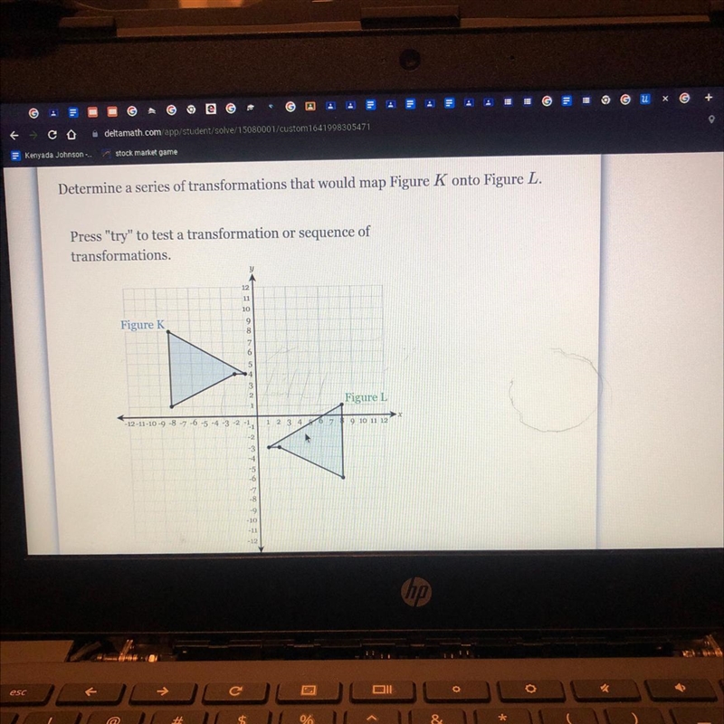 Determine a series of transformations that would map Figure K onto Figure L.Press-example-1