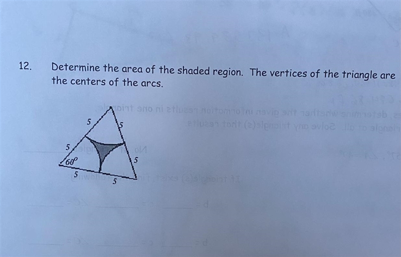 12) Determine the area of the shaded region. The vertices of the triangle are the-example-1