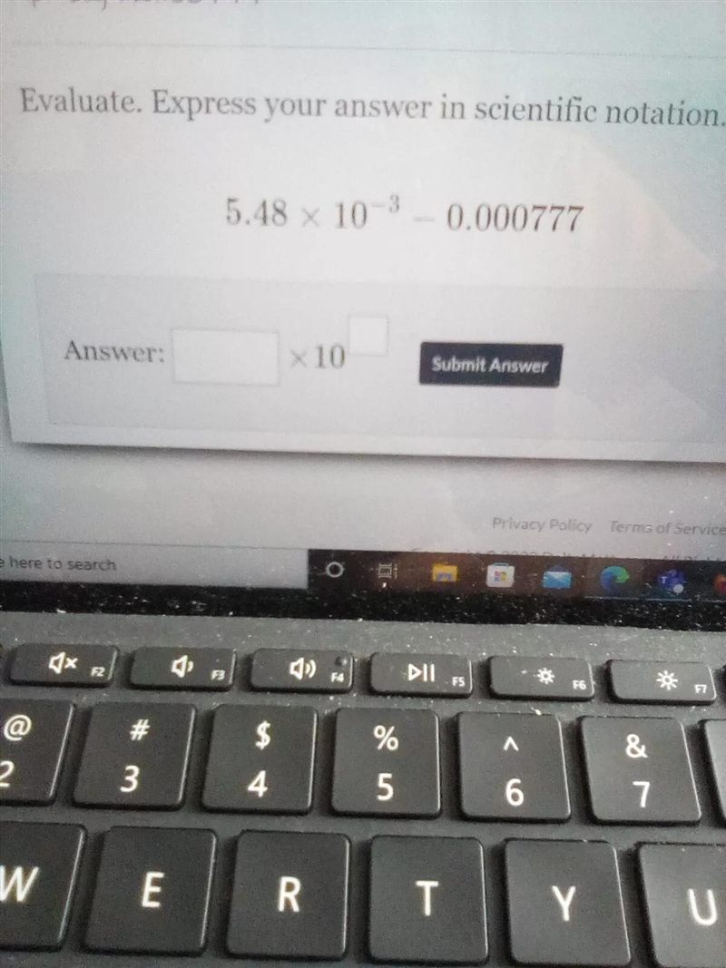 Evaluate, Express your answer in scientific notation 5.48 x 10^-3 -0.000777-example-1