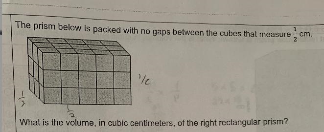 The prism below is packed with no gaps between the cubes that measure1/2 cm.What is-example-1