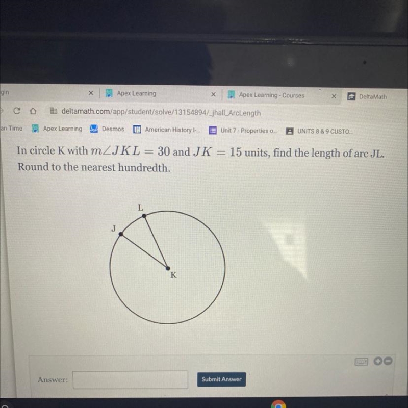 In circle K with m/JKL = 30 and JK = 15 units, find the length of arc JL. Round to-example-1