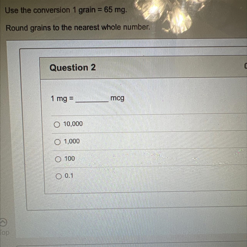 Use the conversion one grain equals 65 mg round grains to the nearest whole number-example-1