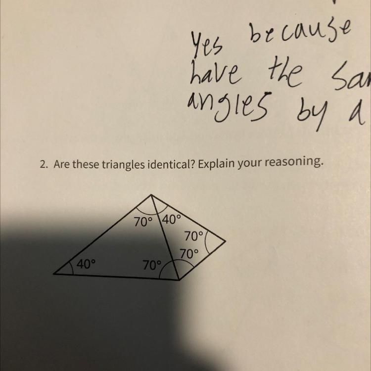 Are these triangles identical? Explain your reasoning.-example-1