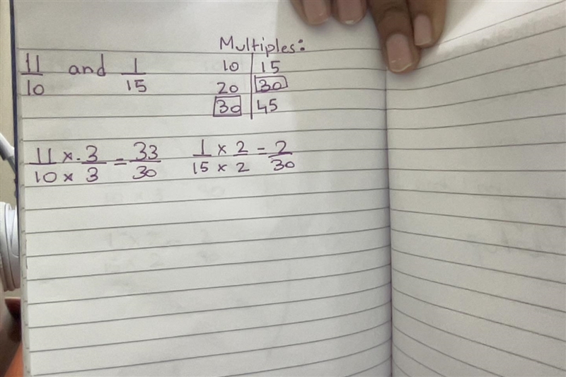 Find the least common denominator of 11/10 and 1/15-example-1