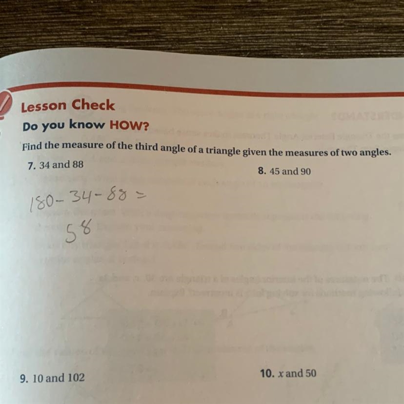 Find the measure of the third angle of a triangle given the measure of two angles-example-1