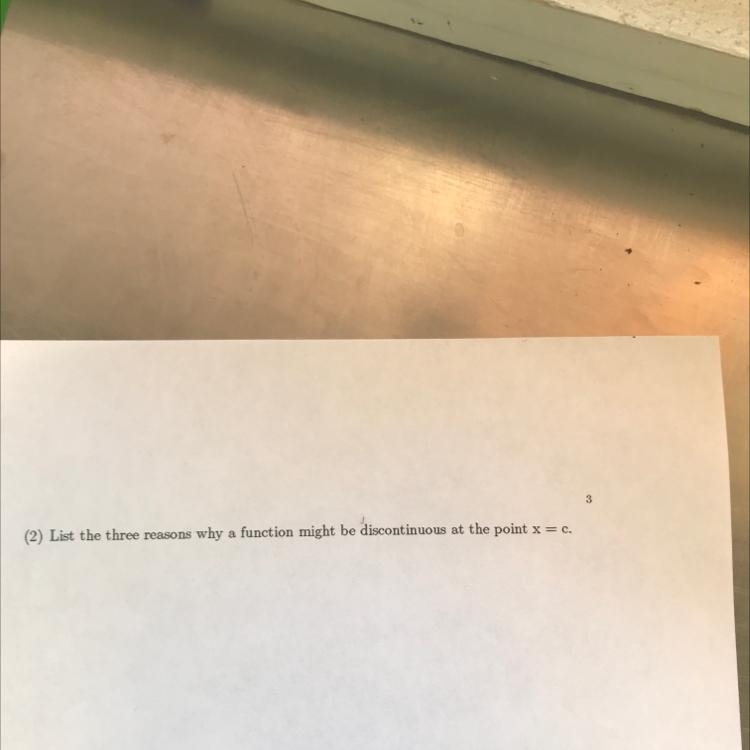 List the three reasons why a function might be discontinuous at the point x=c-example-1