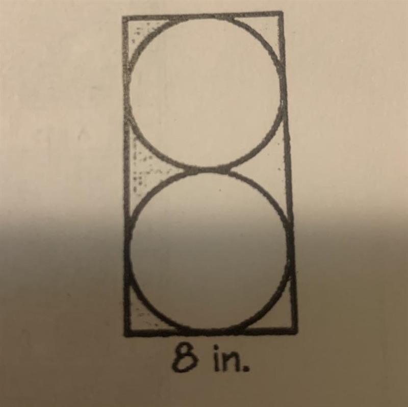 Find the area outside the circles but inside the rectangle of the figure to the right-example-1