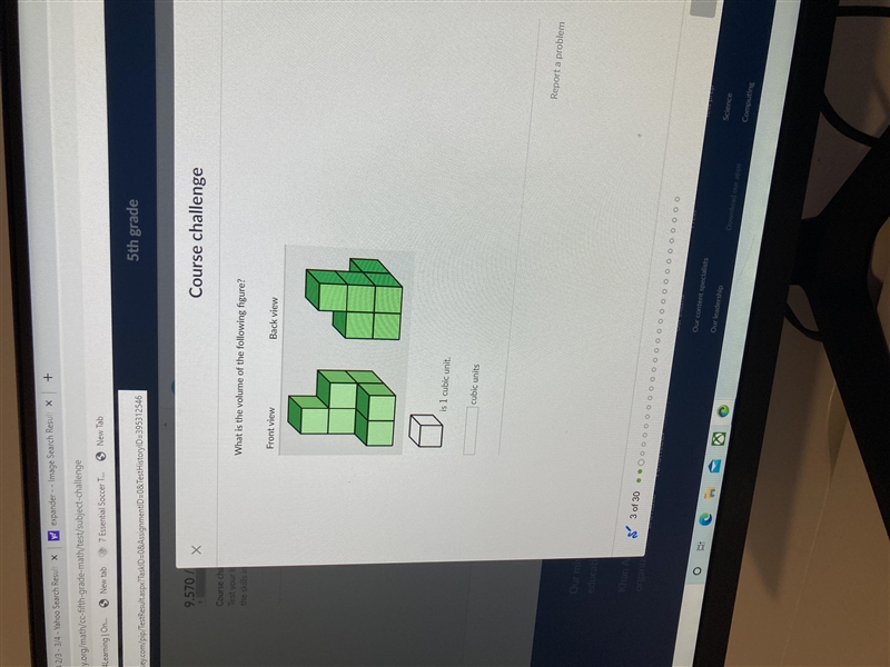 the skills inWhat is the volume of the following figure?Front viewBack viewiş 1 cubic-example-1