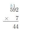 Ann starts to use the standard algorithm to solve 592 *7. Her work is shown below-example-1