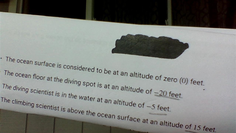 The distance from the climber to the ocean surface is the same as the distance from-example-1