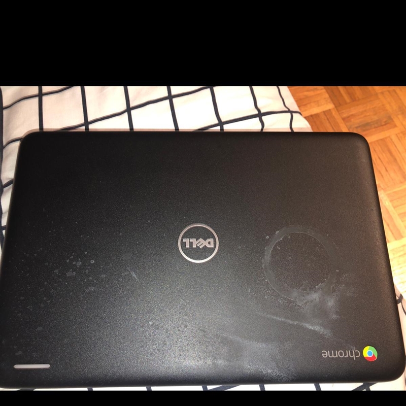 How can get a cup stain off my Chromebook top? Like I tried everything. And I start-example-1