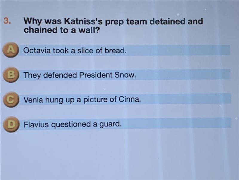 Why was katniss's prep team detained and chained to a wall-example-1