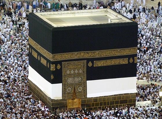 Compare the Kaaba to a different religious site around the world. In what ways are-example-1