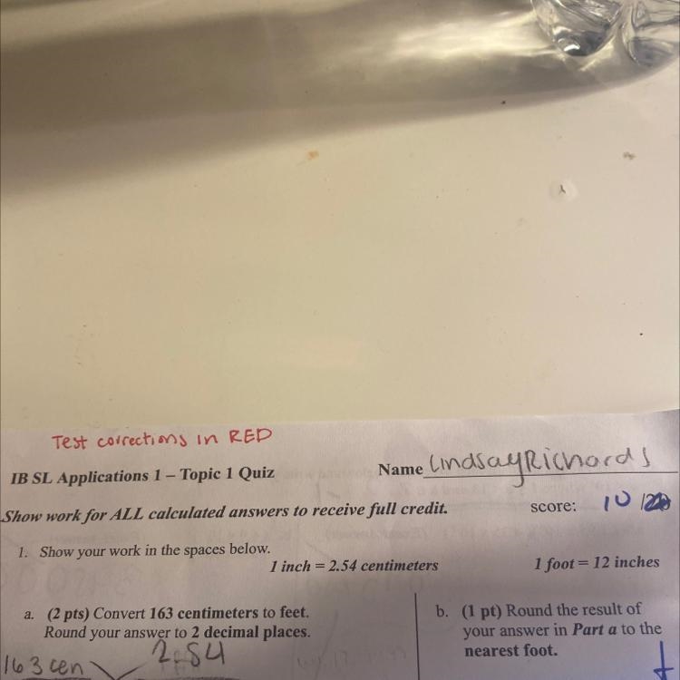 Convert 163 centimeters to feet. Round your answer to 2 decimal places-example-1