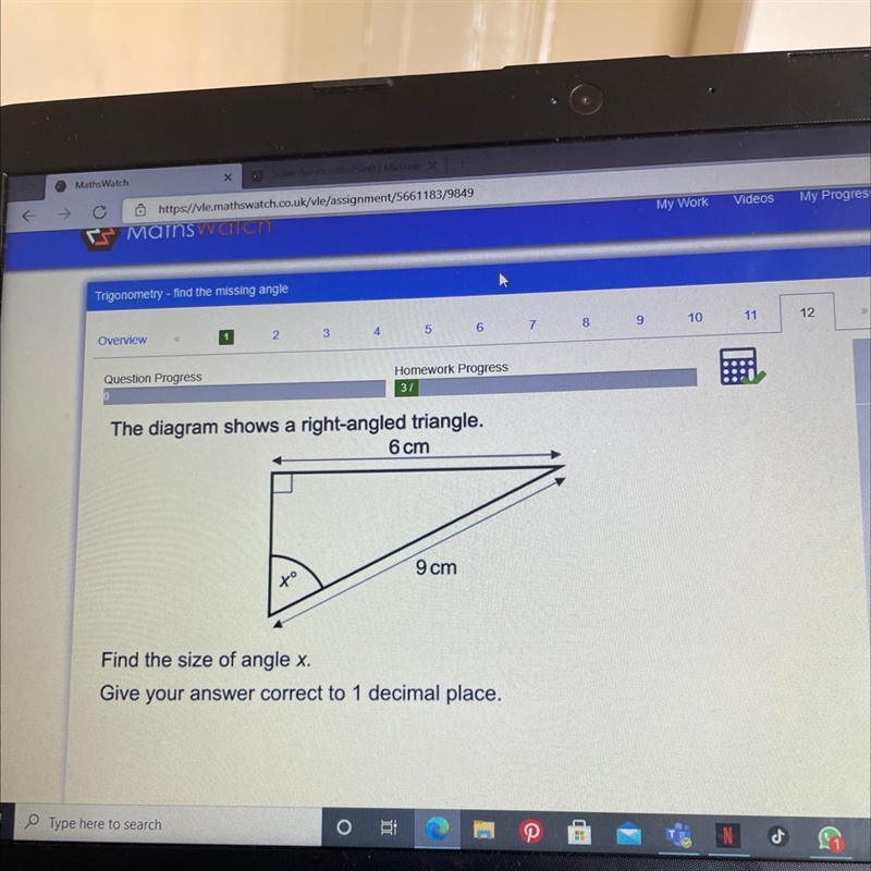 The diagram shows a right-angled triangle. 6 cm 9 cm to Find the size of angle x. Give-example-1